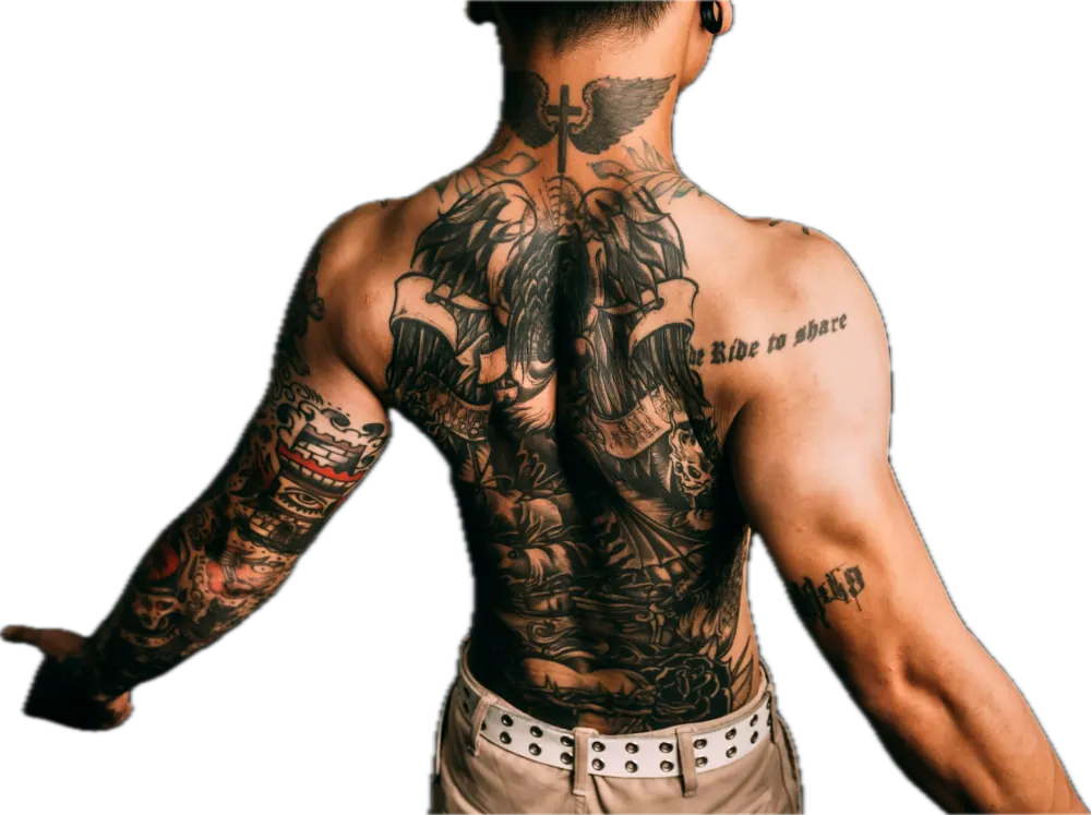 Man with a full back and arm tattoo