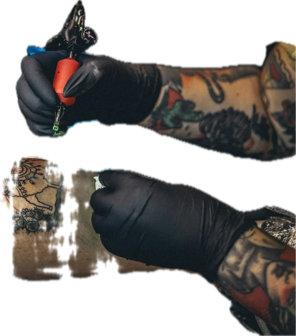 Gloved hands holding tattoo equipment